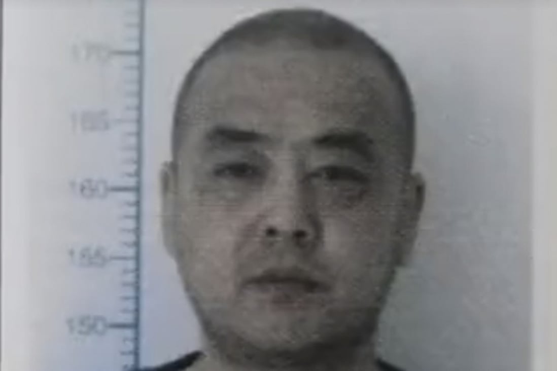 Police mug shot of criminal Batu Menghe. Officials who let the convicted murderer walk free just months into a 15-year sentence have now been punished. Photo: Handout