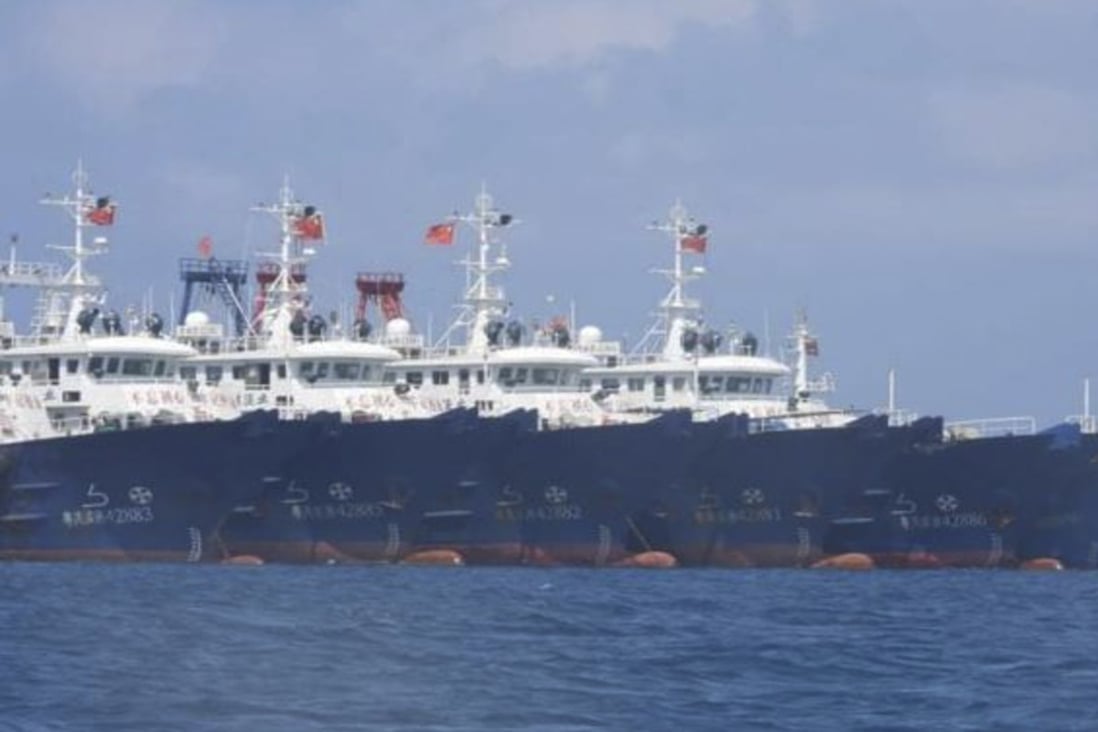Some of the 220 Chinese vessels moored at Whitsun Reef, South China Sea, on March 7, believed by the Philippine government to have been crewed by militias. Photo: AP