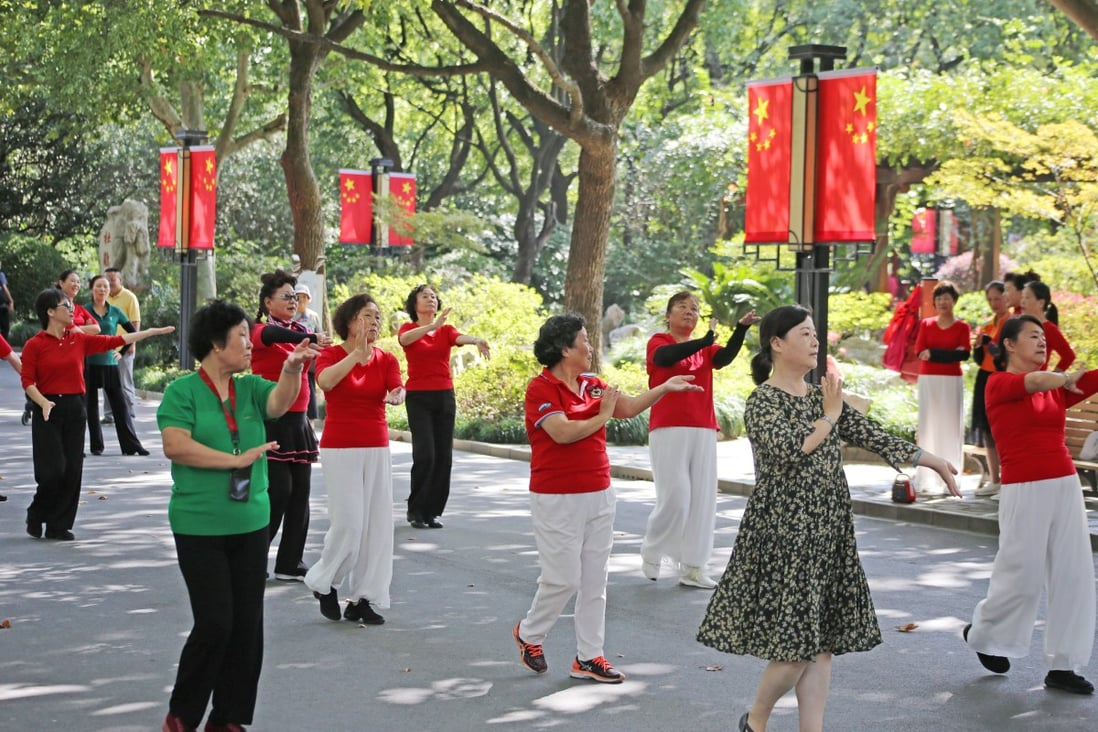 Elderly people dance in a park in Shanghai, China. Photo: Getty
