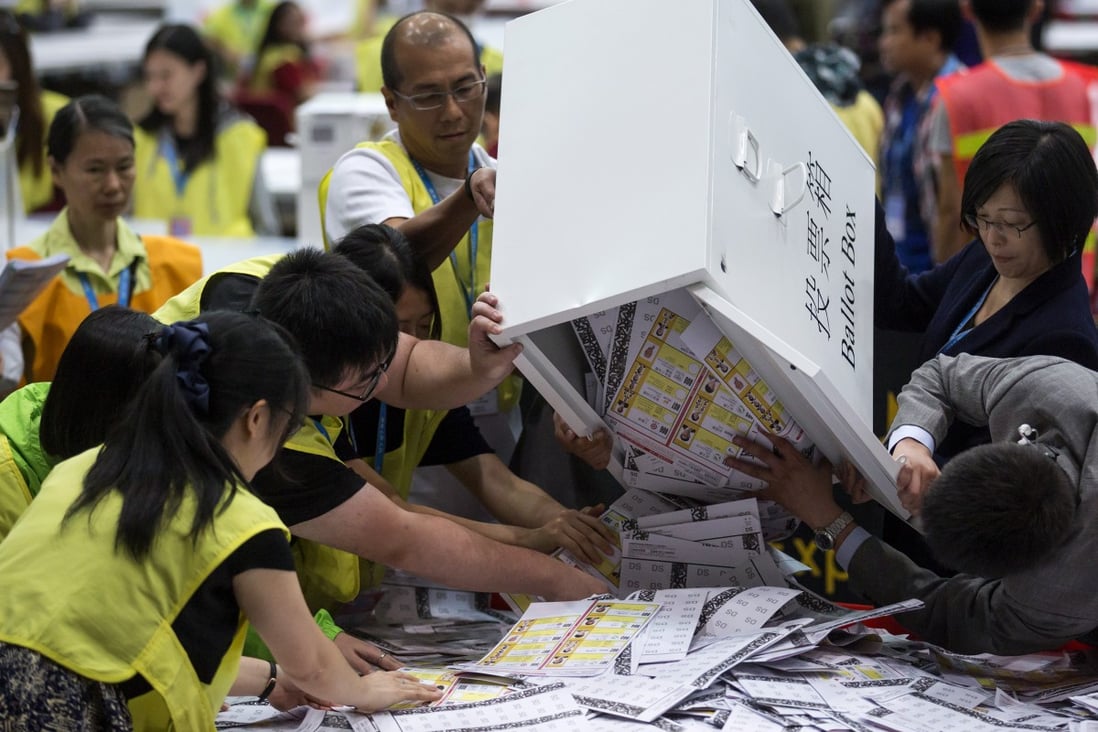 Officials empty votes in the 2016 Legislative Council election from a ballot box at the Central counting station in Hong Kong on September 5. Photo: Bloomberg
