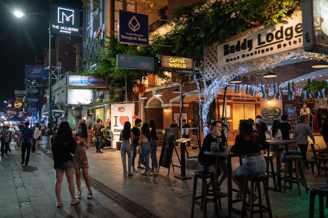 Customers have a drink outside a bar in Bangkok on March 12. Photo: Bloomberg