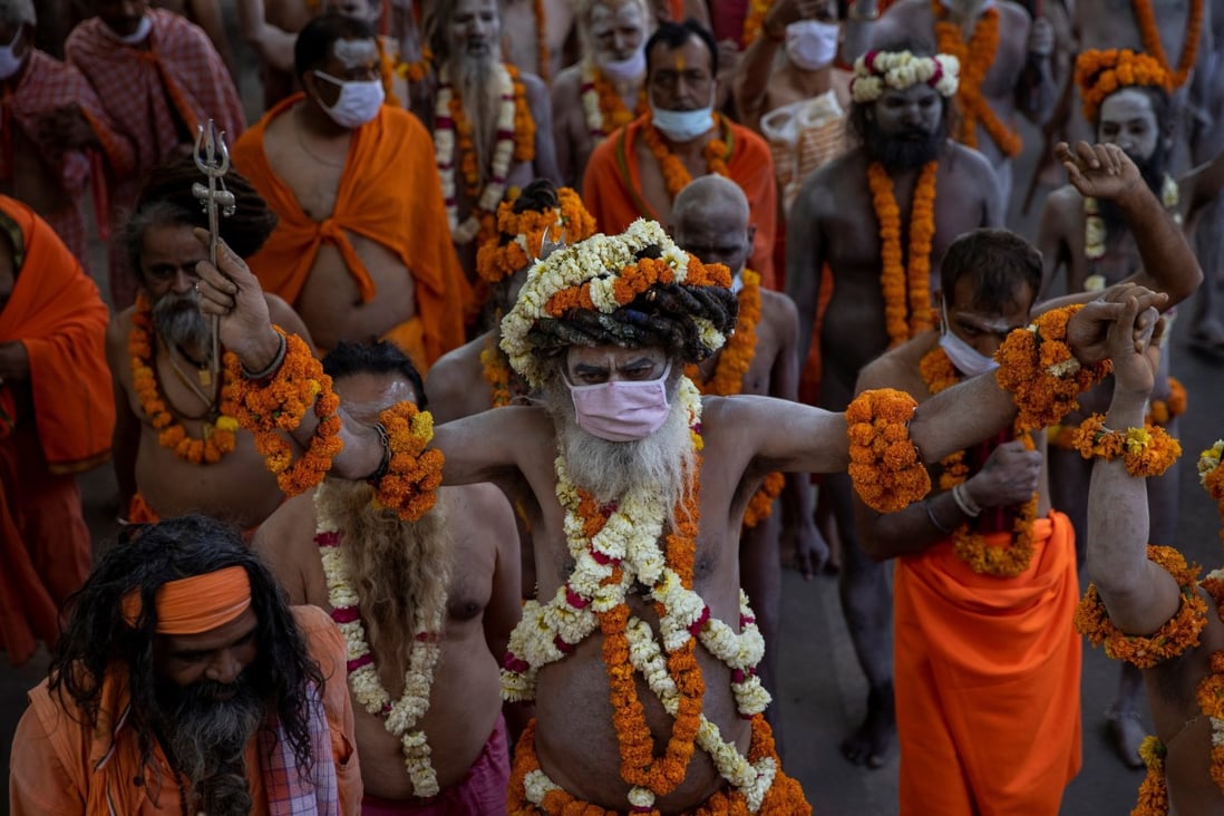 Naga Sadhus, or Hindu holy men, participate in the procession for taking a dip in the River Ganges during the Kumbh Mela festival, to which crowds are flocking despite India’s surge in Covid-19 cases. Photo: Reuters