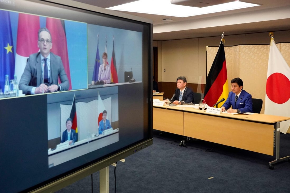 Japan’s Foreign Minister Toshimitsu Motegi and Defence Minister Nobuo Kishi, right, attend a video conference with German Foreign Minister Heiko Maas and Defence Minister Annegret Kramp-Karrenbauer on Tuesday. Photo: Pool via AFP