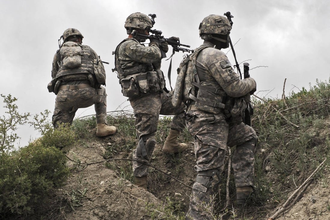 US soldiers take position during a patrol in Ibrahim Khel village of Afghanistan’s Khost province in April 2010. Photo: AFP