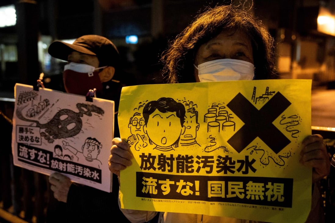 A protester holds a slogan which reads, ‘Don’t release the radioactive water’, at a rally in Tokyo on April 13, 2021. Photo: AFP 