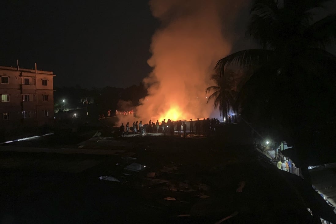 Flames rise from a fire in a makeshift market near a Rohingya refugee camp in Bangladesh on April 2. Photo: AP