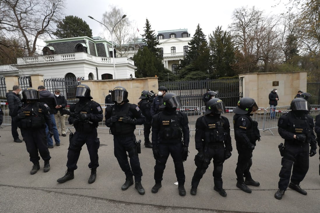 Riot police guard the area as protesters gather in front of the Russian Embassy in Prague, Czech Republic, on Sunday. Photo: AP