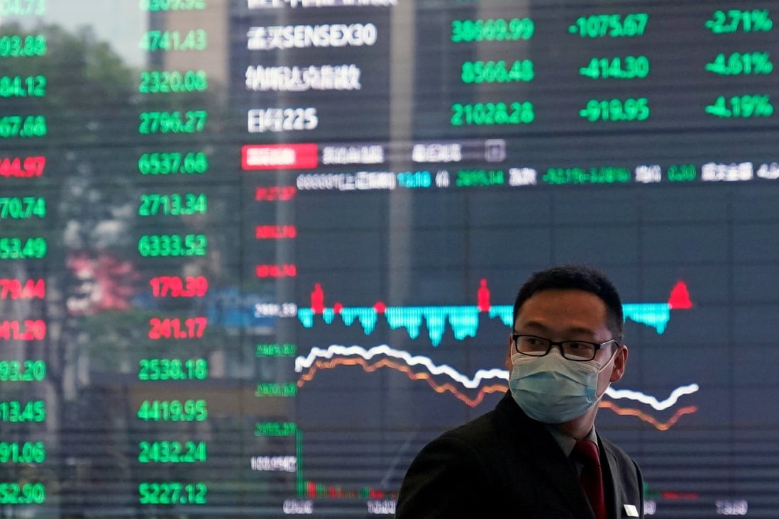 A man wearing a protective mask is seen inside the Shanghai Stock Exchange building. Photo: Reuters