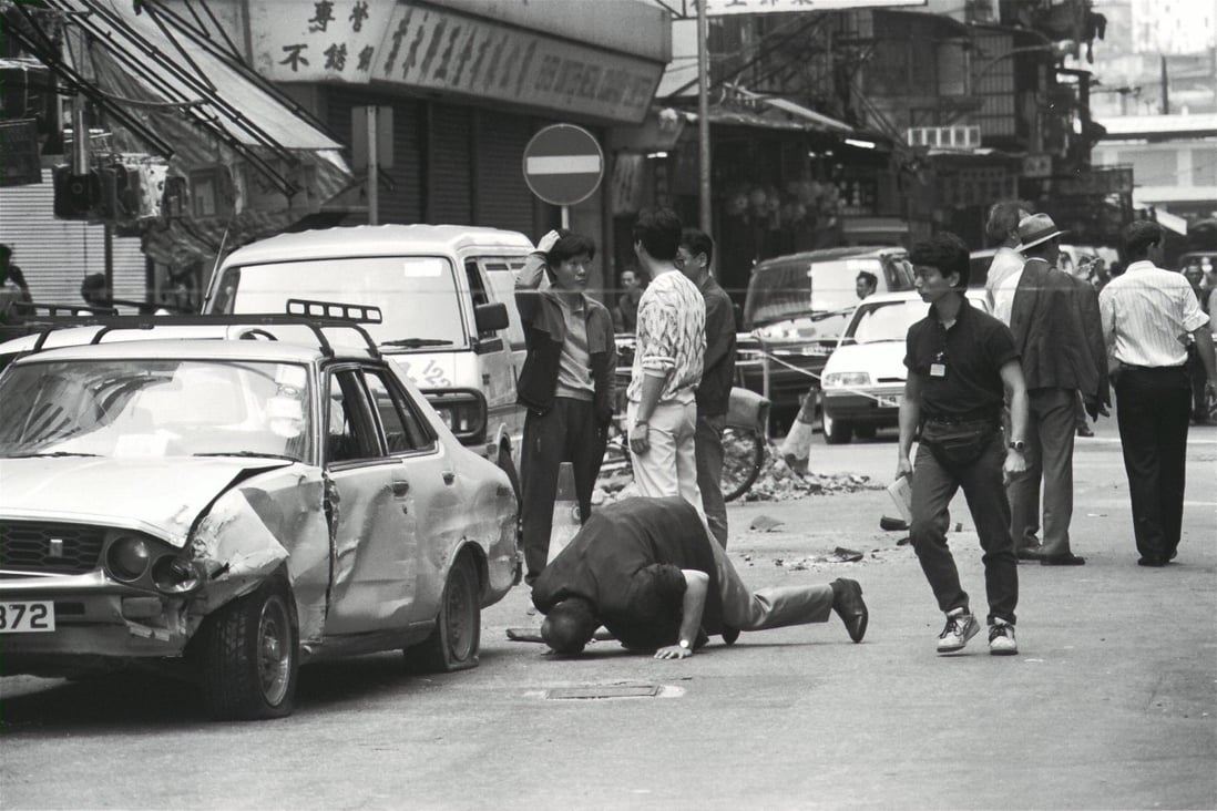 Police inspect a car crashed into by a taxi hijacked by armed men in Tai Kok Tsui, in 1992. Photo: SCMP