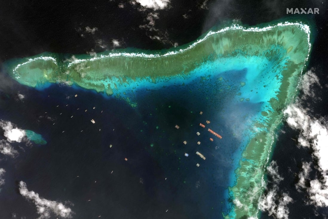 Satellite imagery taken on March 23, 2021,  by  Maxar Technologies shows Chinese vessels anchored at the Whitsun Reef, around 320km (175 nautical miles) west of Bataraza in Palawan in the South China Sea.Photo: 2021 Maxar Technologies/AFP