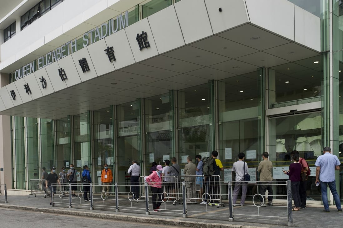 People queue outside a Hong Kong vaccination centre. Photo: AP