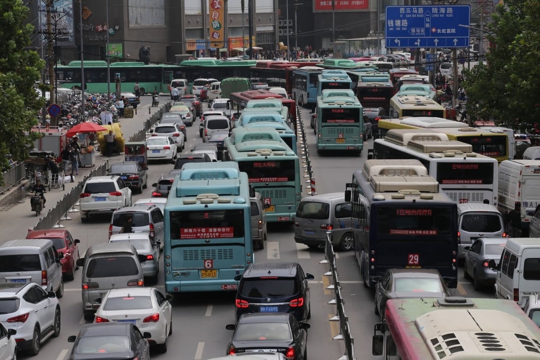 Traffic around a school in Henan became so unbearable for one parent that she spent US$154,000 to build two footbridges for the students. Photo: Getty Images