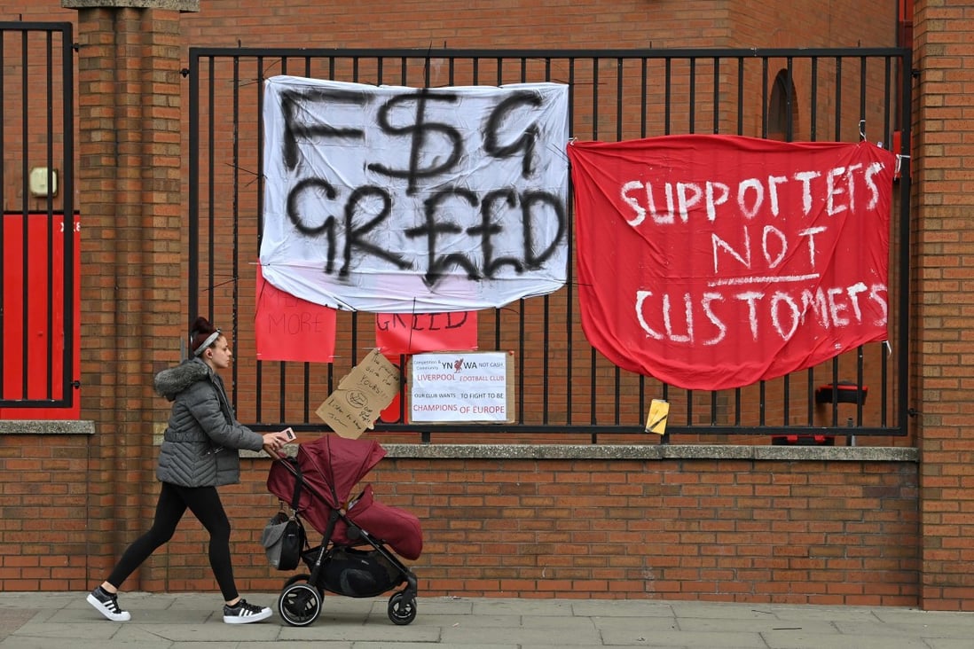 Banners critical of the European Super League project hang from the railings of Anfield stadium in Liverpool, England on April 21, 2021. Photo: AFP