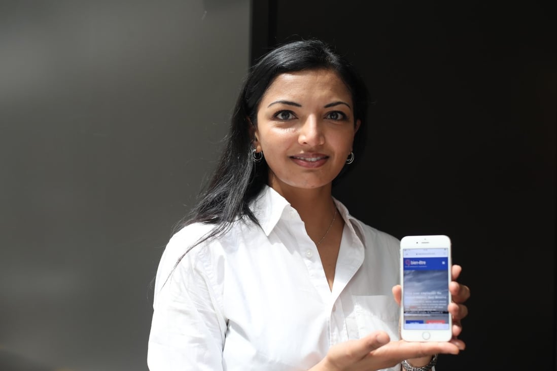 Dr Gira Patel, a Hong Kong-based mental health counsellor, poses with bien-être, a mental health app that she co-founded. Photo: Xiaomei Chen