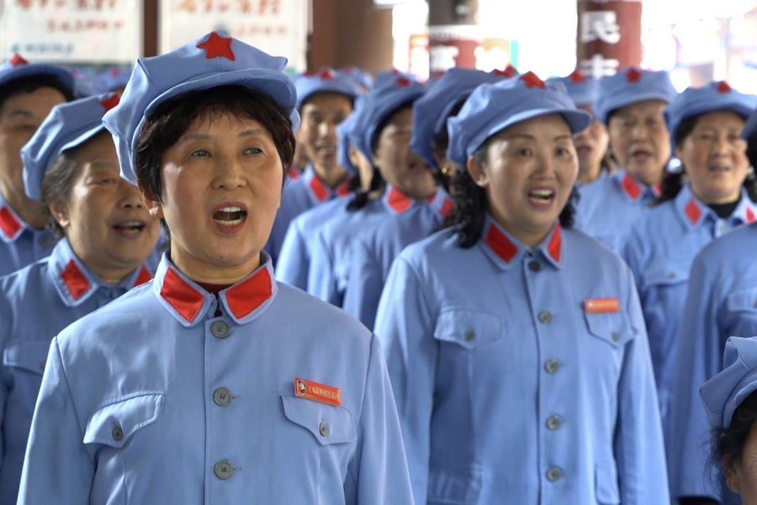 Local retirees sing Red Army revolutionary songs in Zunyi in southwestern China’s Guizhou province on April 12, 2021. The group, aged from their late 50s to over 80, gather regularly to sing to tourists visiting the nearby Zunyi Memorial Museum. Photo: AP 