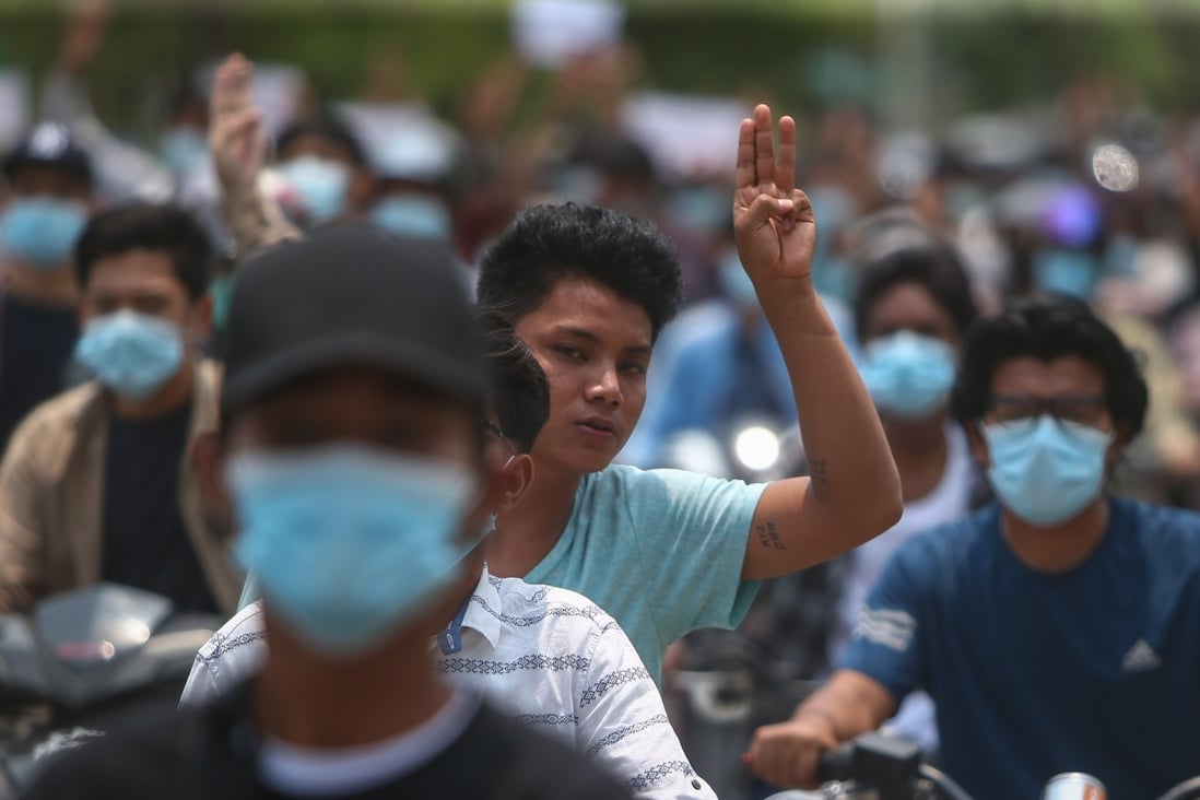 A demonstrator flashes the three-finger salute during a protest in Mandalay, Myanmar, against the military coup, on April 28. Members of a newly formed government of national unity have told Asean that it will not negotiate with the junta until they release all political prisoners. Photo: EPA-EFE