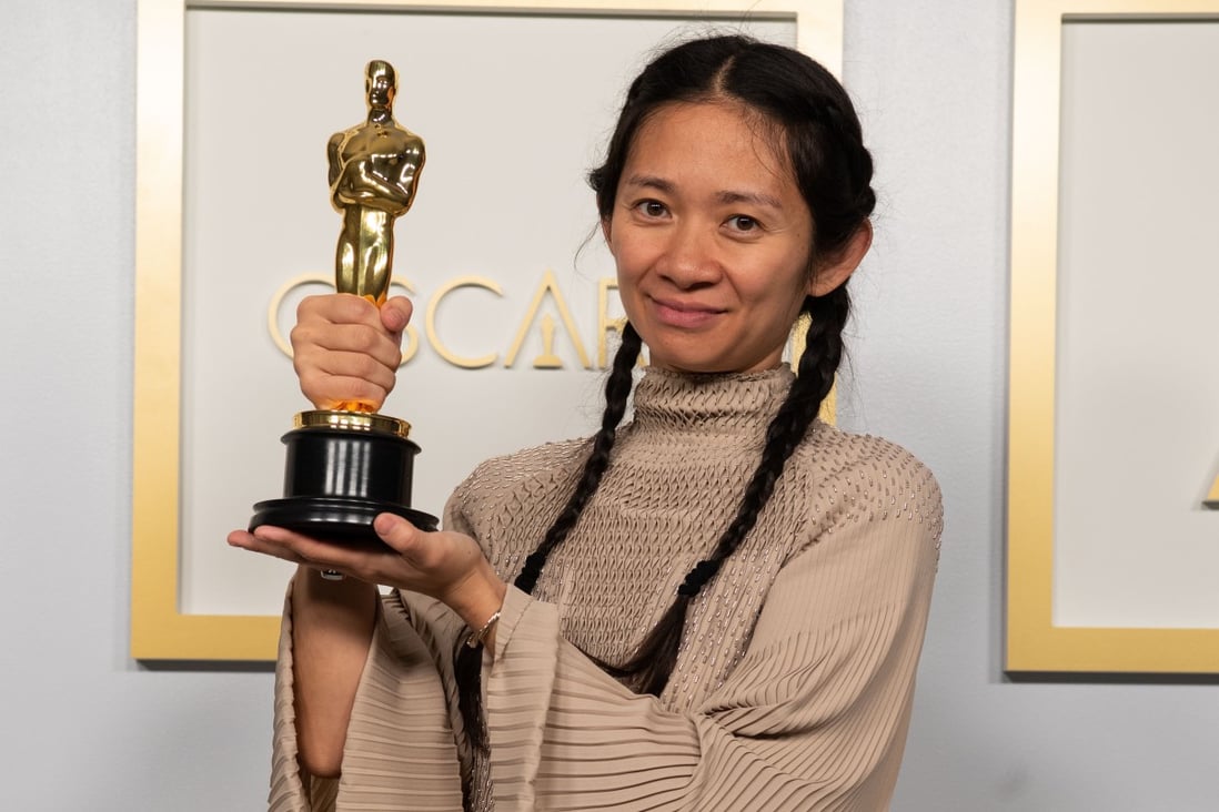 Chinese director and producer Chloe Zhao poses with one of her Oscars awards for best picture and director for Nomadland, at the press room of the 93rd Oscars Academy Awards at Union Station in Los Angeles on April 25, 2021. Photo: AMPAS/PA Media/DPA