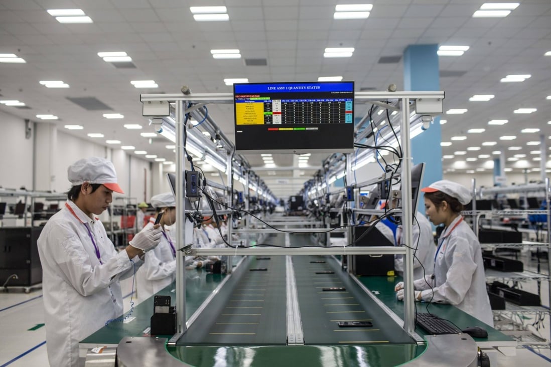 Workers in Vietnam perform quality checks on smartphones. The country was recently named a top-three sourcing market by a quarter of respondents in a global poll. Photo: Bloomberg