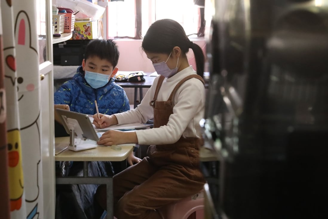 Ben and May study at home amid the coronavirus pandemic. A year of online learning from home has taken its toll on Hong Kong students like them. Photo: K. Y. Cheng