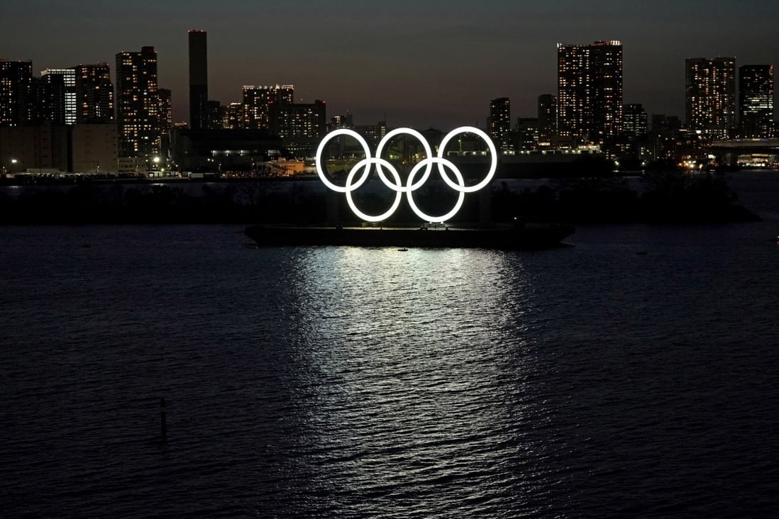 A giant Olympic rings monument at dusk in Odaiba Marine Park, Tokyo. Photo: EPA