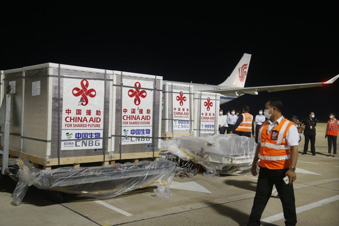 Workers transport the Sinopharm Covid-19 vaccine at the Phnom Penh International Airport in Cambodia. Photo: Xinhua