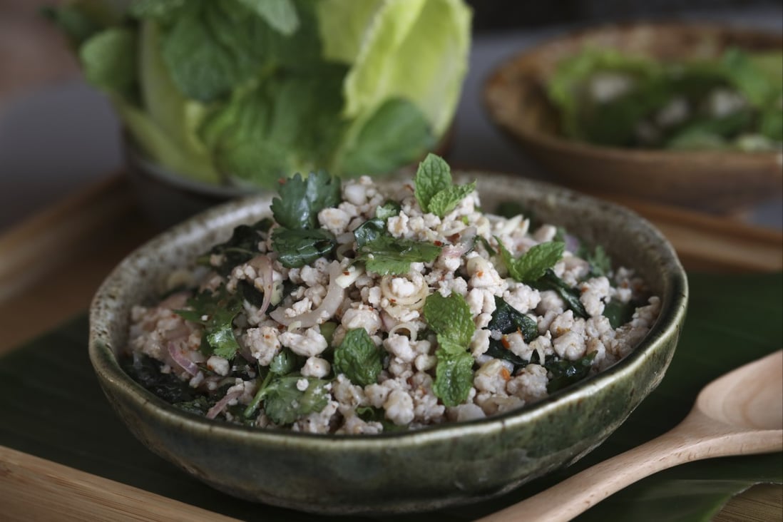 Larb moo is a warm minced pork salad, with toasted rice powder, lime juice and chillies. Photo: Jonathan Wong