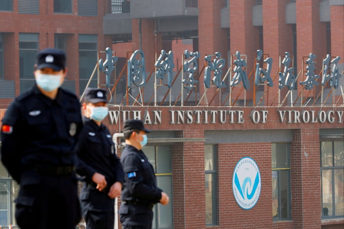 Security personnel keep watch outside the Wuhan Institute of Virology during the February visit by the World Health Organization (WHO) team. Photo: Reuters
