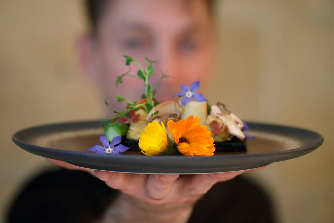 French chef Laurent Veyet displays a dish in his restaurant Inoveat, which serves insect-based food, in Paris, France, on May 12. Photo: Reuters
