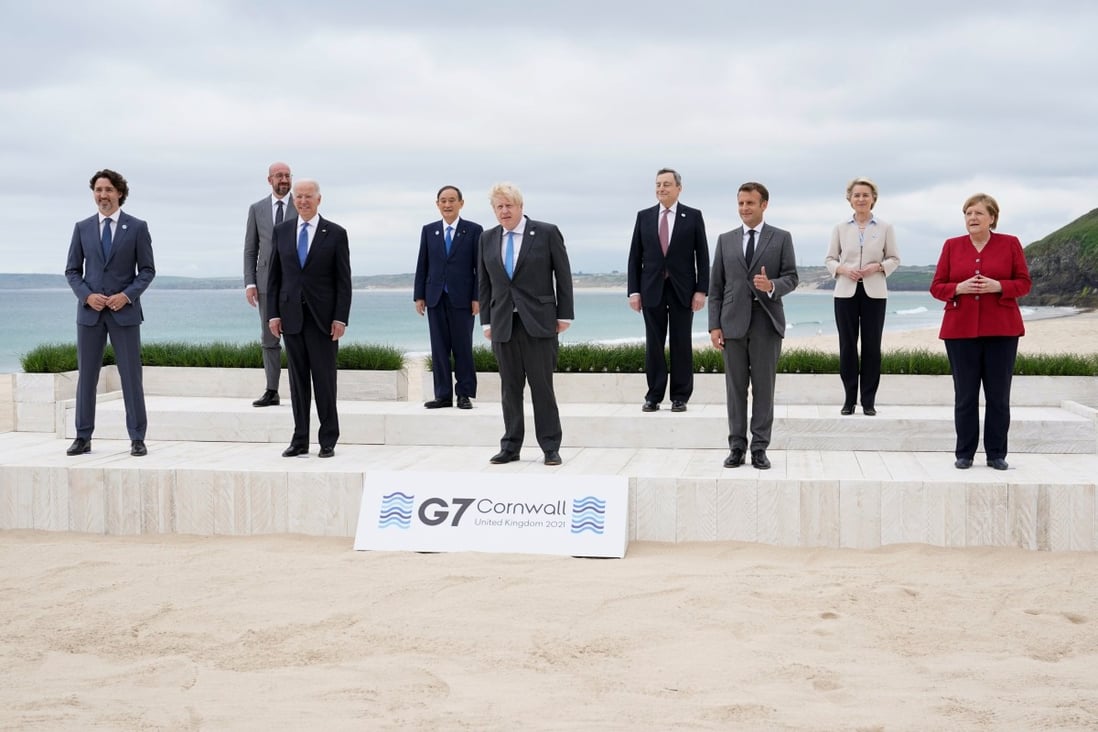 Leaders pose for a group photo at the G7 summit in Carbis Bay, Britain. Photo: Reuters