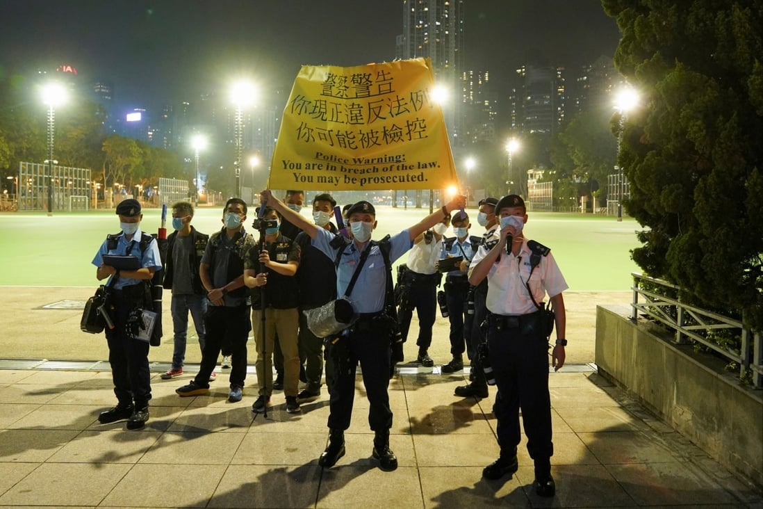 Hong Kong police officers stand at the entrance to Victoria Park to prevent people from gathering for the annual June 4 vigil in 2021, the 32nd anniversary of the crackdown on pro-democracy demonstrators at Beijing’s Tiananmen Square. Photo: Reuters