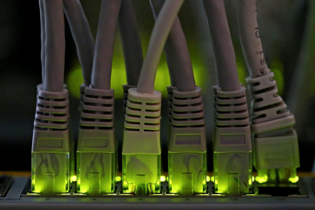 LAN network cables are plugged into a bitcoin mining computer server. Photo: Reuters