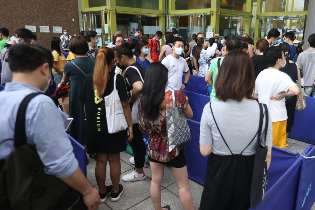 Hongkongers queue up to get their Covid-19 shots at the Community Vaccination Centre, Sun Yat Sen Memorial Park Sports Centre. Photo: K. Y. Cheng