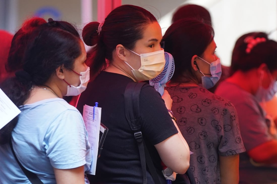 Foreign domestic helpers queue up for Covid-19 tests in Quarry Bay, Hong Kong. Photo: SCMP / Sam Tsang