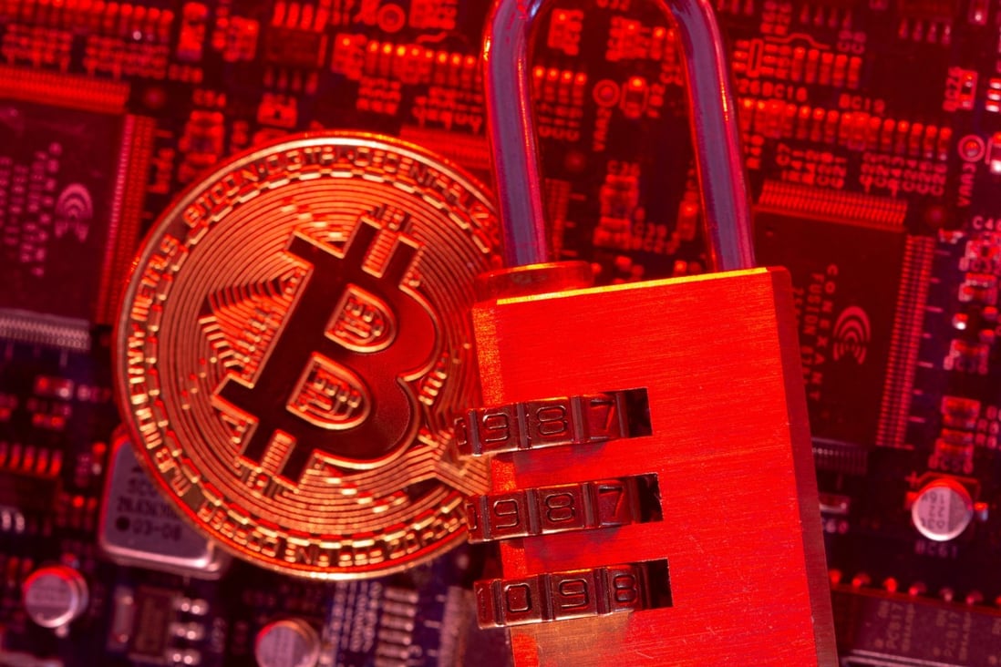 Representation of virtual currency Bitcoin and a padlock are placed on a computer motherboard in this illustration picture taken on May 4. Photo: Reuters