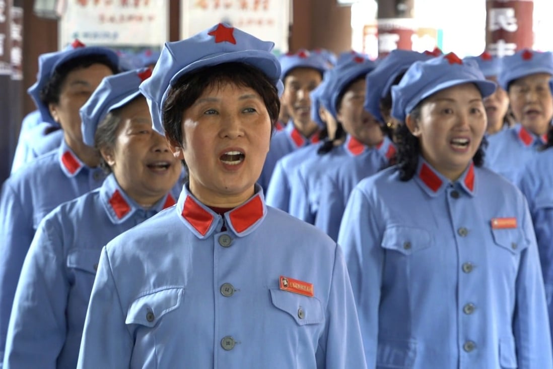 Local retirees gather to sing Red Army revolutionary songs in the city of Zunyi in Guizhou province on April 12. China is considering raising the retirement age, which is now 60 for men and up to 55 for women. Photo: AP 