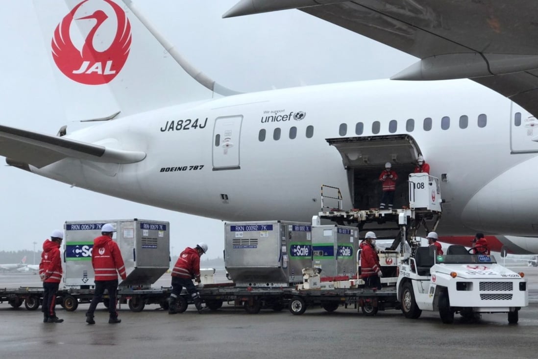 Airport workers in Japan load Covid-19 vaccines into a plane bound for Taiwan earlier this month. Vietnam is set to receive 1 million doses on Wednesday. Photo: Taiwan Economic and Cultural Representative Office in Japan/Handout via Reuters 