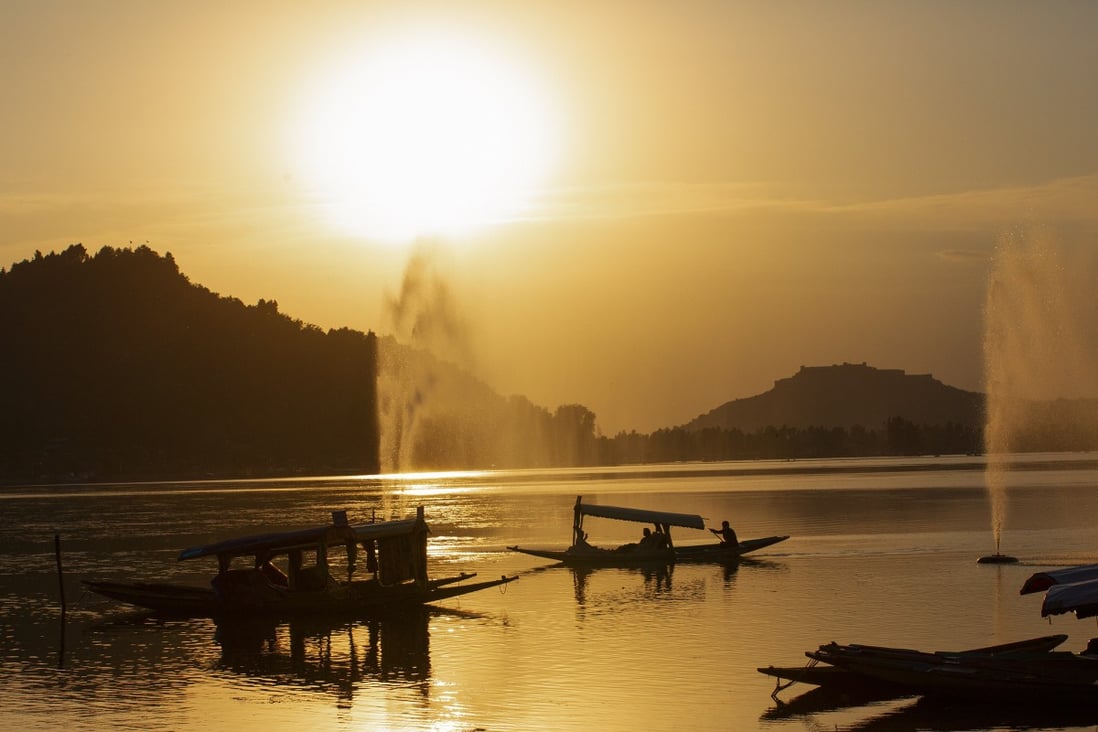 Small boats are seen at sunset on Dal Lake in Srinagar, the summer capital of Indian-administered Kashmir, earlier this month. Photo: Xinhua