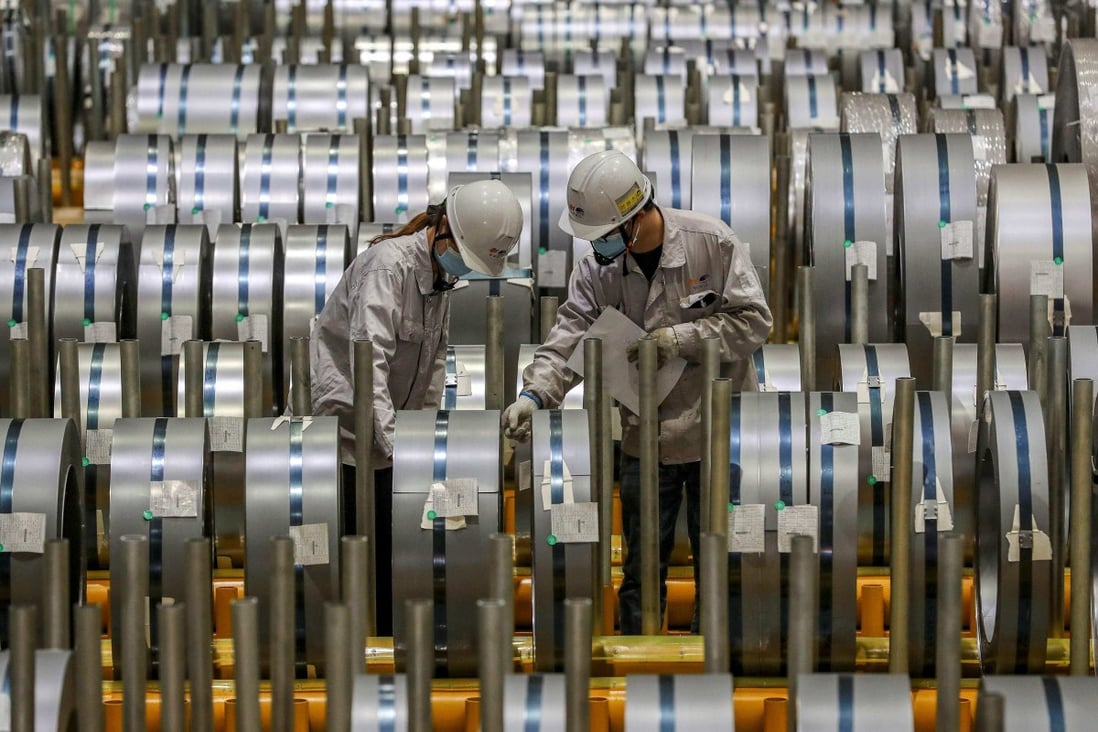Workers check rolls of sheet aluminium at a factory in Wuhan, China, on May 8. According to the Institute of International Finance, more countries are seeing price mark-ups due to long delivery times and the rising cost of inputs into production. Photo: AFP