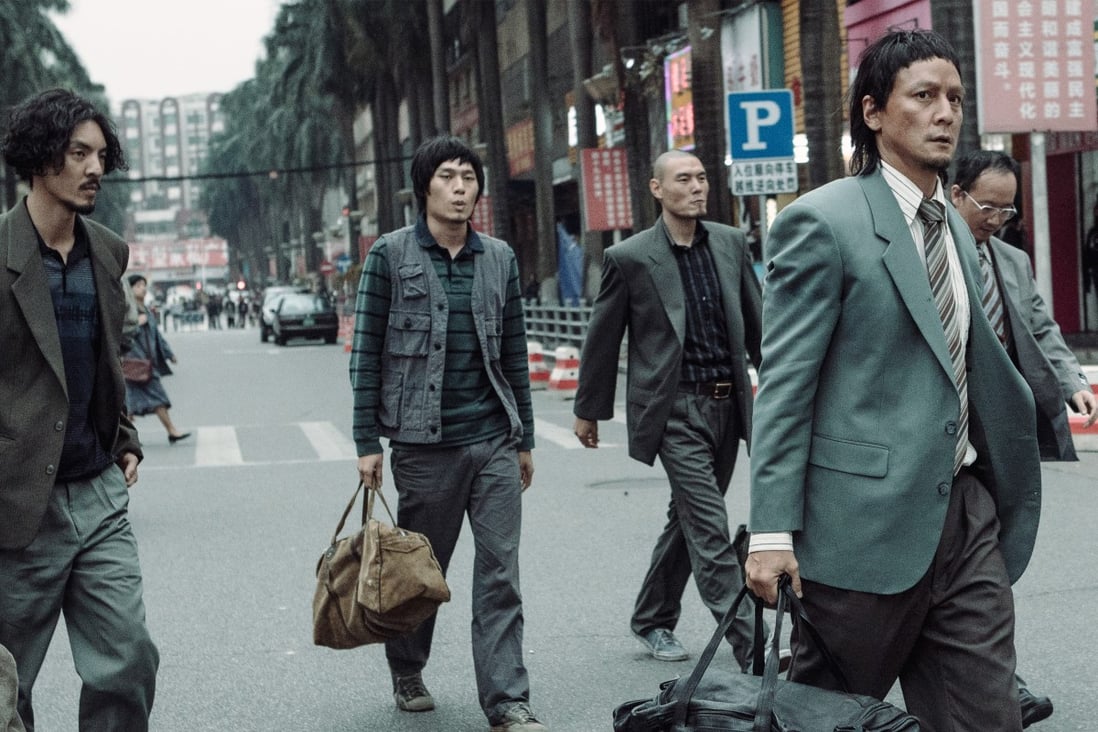 Daniel Wu (right) plays a bank robber in a still from Caught in Time (category IIB, Mandarin), directed by Lau Ho-leung.