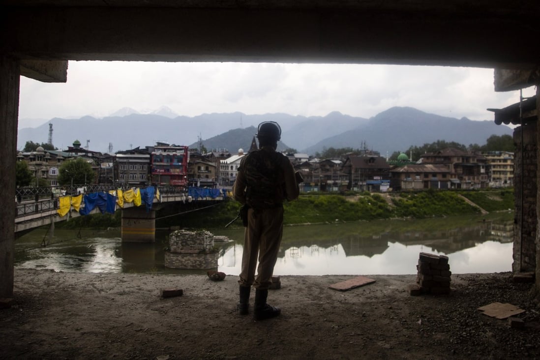 An Indian paramilitary soldier stands watch from a building under construction during a lockdown imposed to prevent the spread of the coronavirus in Srinagar, in Indian-controlled Kashmir, on April 30. Photo: AP