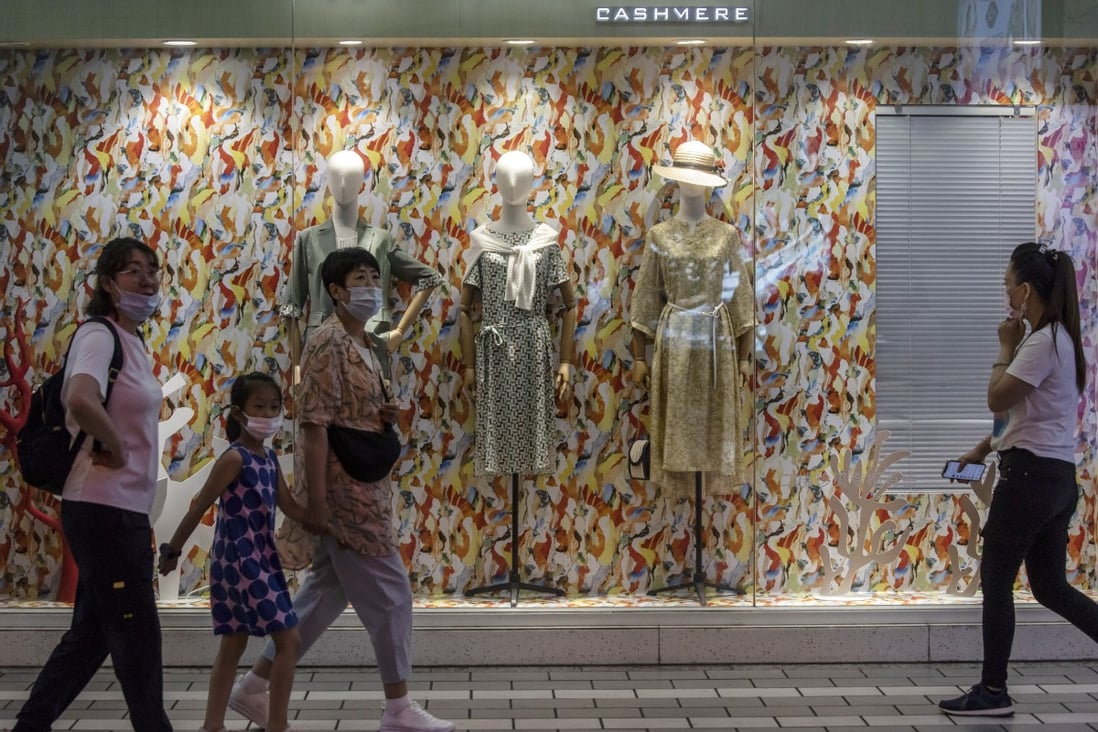 People walk past a store on Nanjing Road in Shanghai, on June 6. China’s retail sales growth slowed to 12.4 per cent year on year in May, from 17.7 per cent in April. Photo: Bloomberg