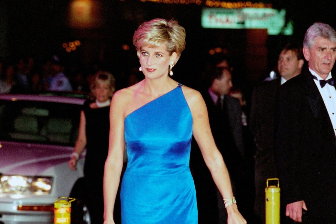 Diana, Princess of Wales wears a Versace one-shouldered satin blue gown  to the Victor Chang Cardiac Research Institute dinner dance at the Sydney Entertainment Centre, Australia, on October 31, 1996. Photo: Tim Graham Photo Library via Getty Images