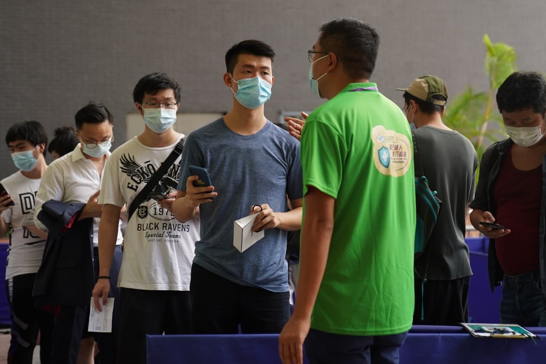 People queue up to get Covid-19 shots at a community vaccination centre at Sun Yat Sen Memorial Park Sports Centre in Sai Ying Pun on June 16. Photo: Sam Tsang