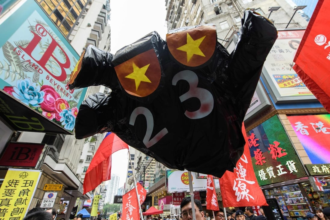 A reference to the controversial Article 23 legislation at a National Day rally in Hong Kong on October 1, 2018. Photo: AFP
