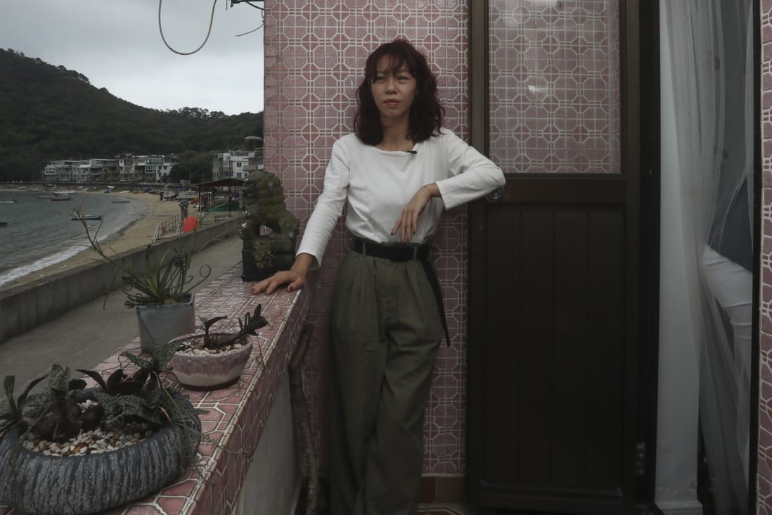 Kodi Wan in her flat in Peng Chau, Hong Kong. She believes in living a minimalist life and encourages people to buy less and swap items they don’t need for others that they do. Photo: Jonathan Wong