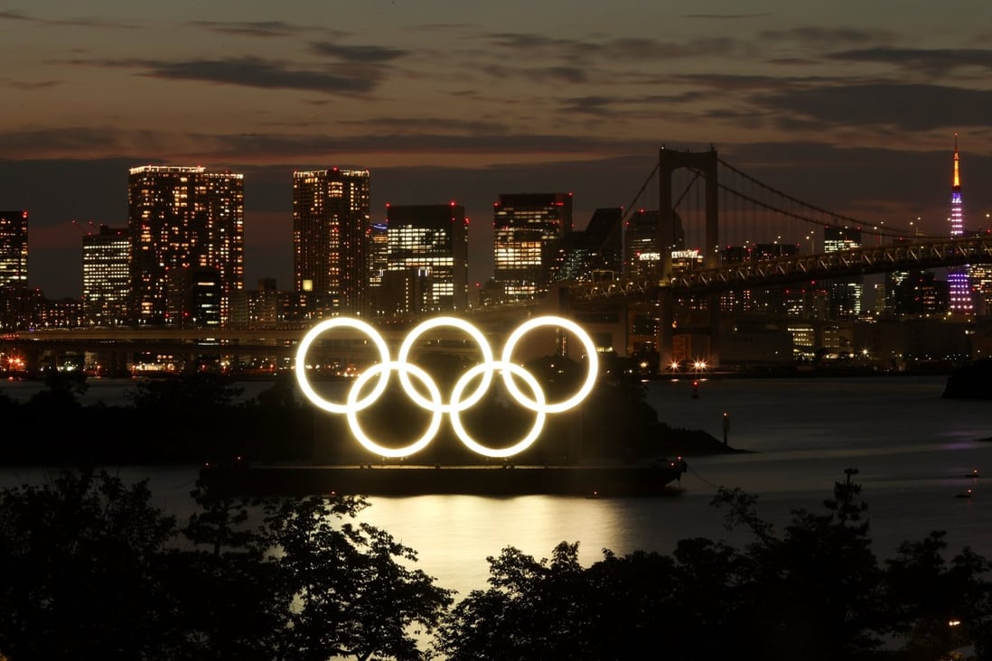A general view of the Olympic Rings installed on a floating platform with the Rainbow Bridge in the background in preparation for the Tokyo 2020 Olympic Games in Tokyo, Japan, on June 21, 2021. Photo: Reuters