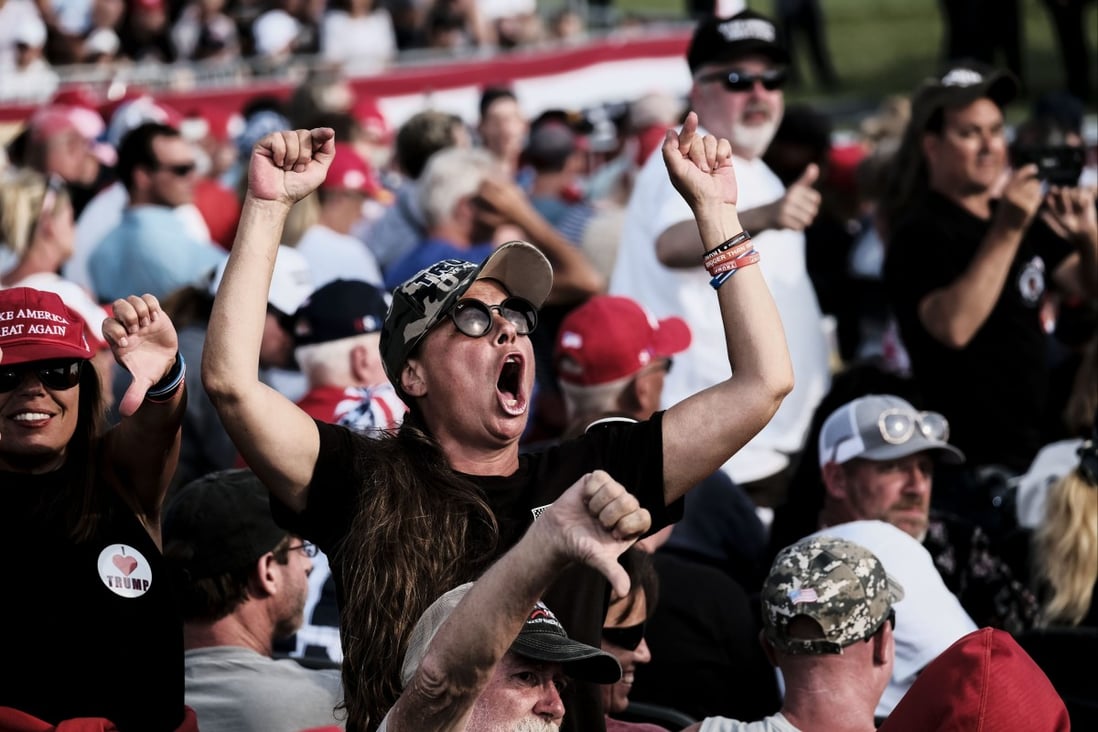 A Trump supporter screams at members of the press during a “Save America” rally by ex-president Donald Trump in Ohio on June 26. Photo: Bloomberg