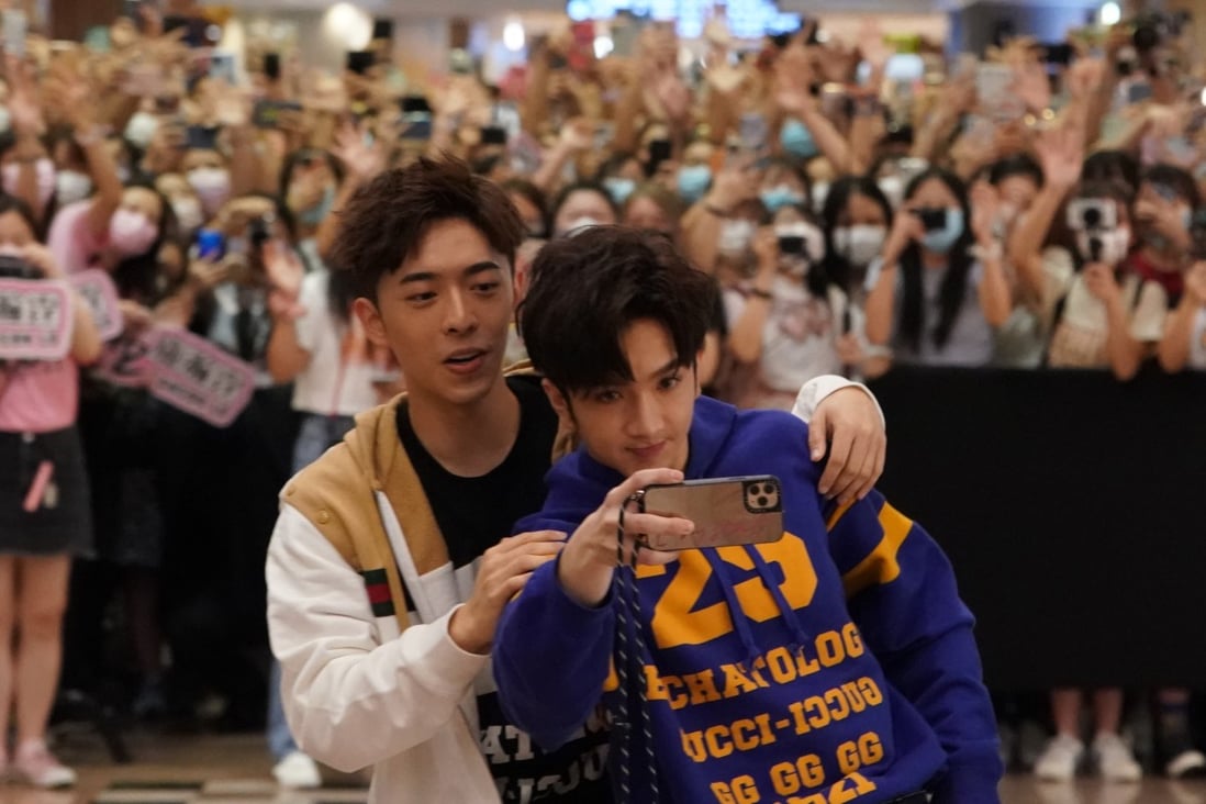 Anson Lo (right) and Edan Lui of the boy band Mirror, who recently starred in the hit drama “Ossan’s Love”, meet fans at a mall in Tsim Sha Tsui on July 10. Photo: Felix Wong