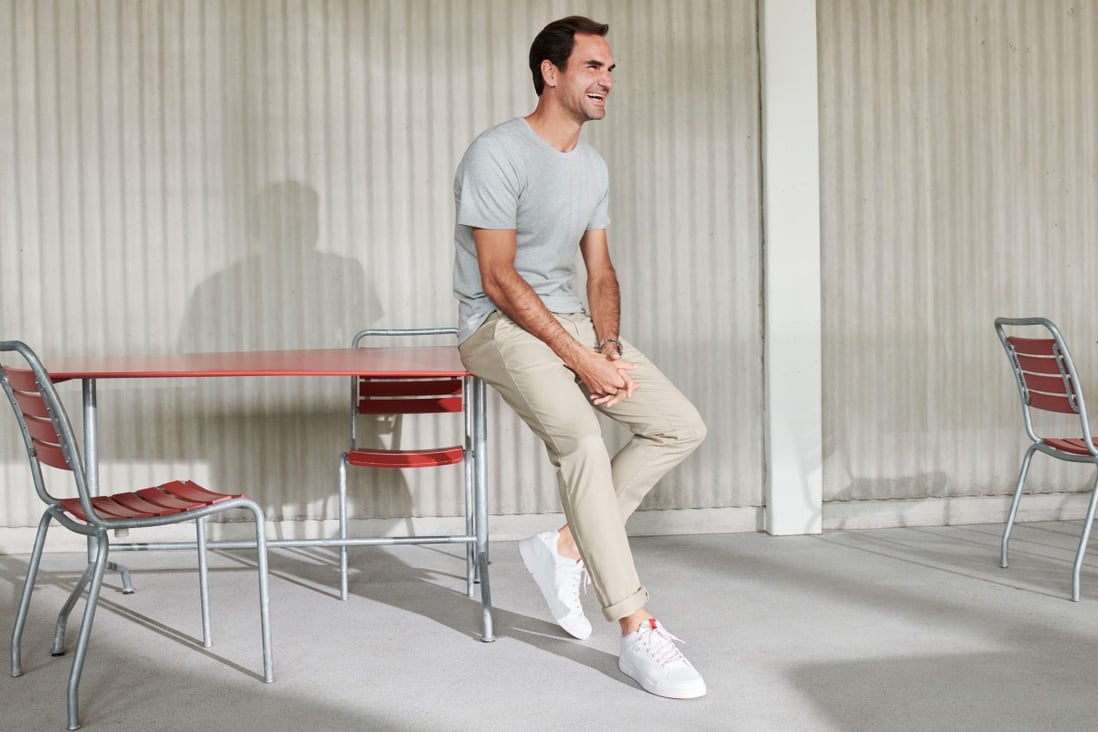 Roger Federer wearing On’s The Roger Centre Court JP all-white sneakers. The Swiss brand, in which the tennis star is an investor, has won over sports pros and the public alike with running shoes that blend comfort and performance.
