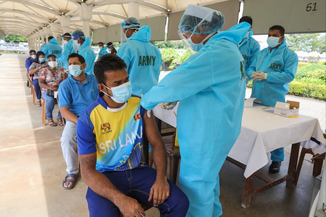 Sri Lankan Army Medical Corps personnel give people the Sinopharm Covid-19 vaccine in a public park in Colombo, Sri Lanka, on July 5. Gavi, the global vaccine alliance, has signed purchase agreements for 11 vaccines, including China’s Sinopharm and Sinovac. Photo: EPA-EFE 
